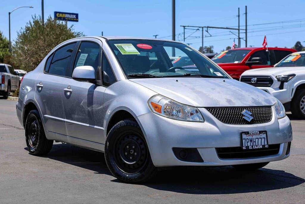 Quicksilver Metallic 2010 Suzuki SX4 Sedan Front-Wheel Drive 6-Speed Manual